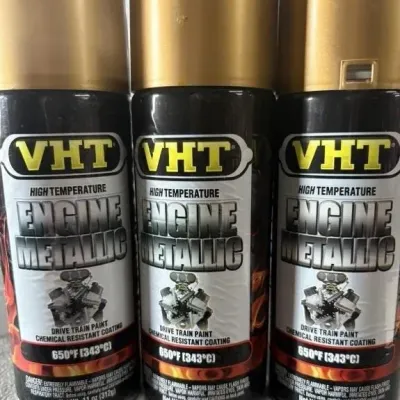 Sale Photo Thumbnail #156: Trio of VHT High Temperature Engine Metallic spray paint cans with gold caps.