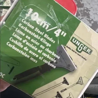 Sale Photo Thumbnail #65: Unger 10cm/4" carbon steel scraper blades in original taped packaging.