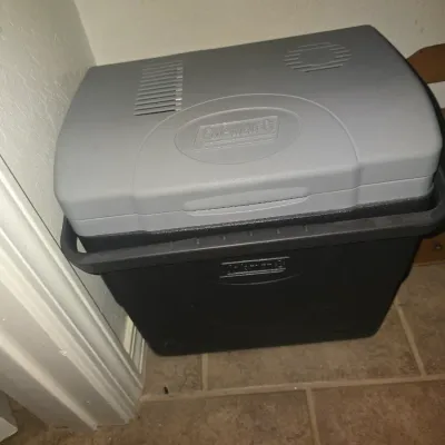 Sale Photo Thumbnail #106: Vintage grey and black Coleman electric thermoelectric cooler with carrying handle.