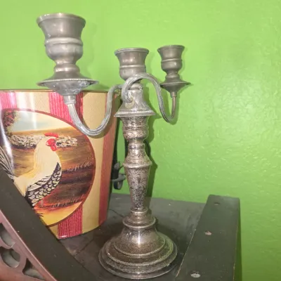 Sale Photo Thumbnail #92: Vintage three-light silver-plated candelabra featuring a beaded trim base and scrolled arms with light surface tarnish.