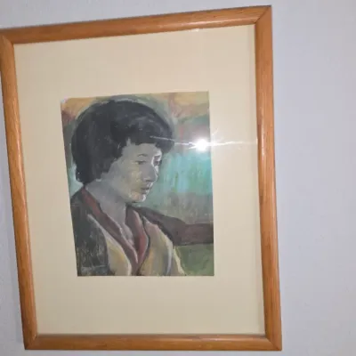 Sale Photo Thumbnail #13: Framed impressionistic portrait artwork depicting a woman, presented in a light oak wood frame with an off-white mat board.