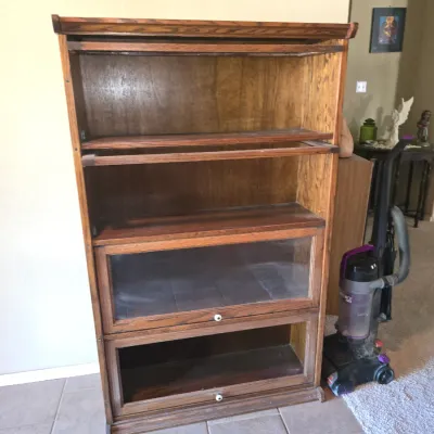 Sale Photo Thumbnail #60: Antique oak four-tier barrister stackable bookcase with glass front doors, two of which are missing glass or door panels.
