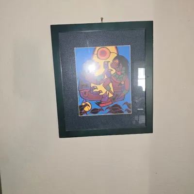 Sale Photo Thumbnail #47: Framed Indigenous Woodlands-style art print featuring figures and birds, double-matted in a dark green frame.