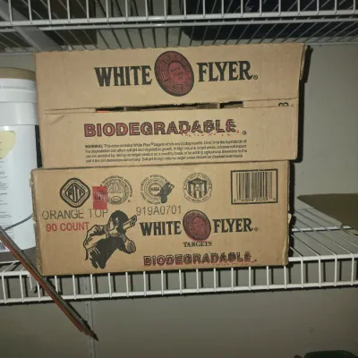 Sale Photo Thumbnail #78: Two cardboard boxes of White Flyer biodegradable orange top clay targets, 90 count per box.