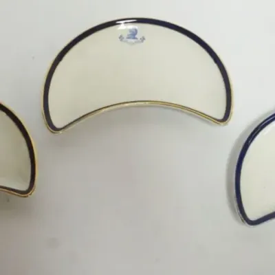 Sale Photo Thumbnail #36: 1036	CRESCENT SHAPED ENGLISH DISHES W/LIONS HEAD CRESTS, EACH APPROXIMATELY 8 IN X 5 IN																																																																																																																																																																								