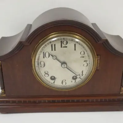 Sale Photo Thumbnail #135: 1135	MINIATURE MAHOGANY MANTLE CLOCK, M WINTERHALDER & HOFMEIER, NINE JEWELS, APPROXIMATELY 9 IN X 4 IN X 6 1/2 IN HIGH																																																																																																																																								