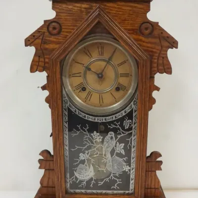 Sale Photo Thumbnail #139: 1139	ANSONIA GINGERBREAD CLOCK W/IMAGE OF OWL OVER SPIDER WEB ON BRANCH, APPROXIMATELY 13 IN X 5 IN X 23 IN HIGH																																																																																																																																															