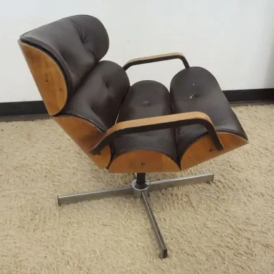 Sale Photo Thumbnail #218: 1217	VINTAGE MID CENTURY MODERN SEGMENTED CHAIR, WEAR TO VINYL, APPROXIMATELY 26 IN X 25 IN X 27 IN HIGH																																																																																																																																																							