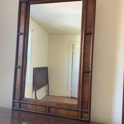 Sale Photo Thumbnail #3: Mid-century modern rectangular wall mirror featuring a dark stained wood frame with raised bamboo-style overlay accents.