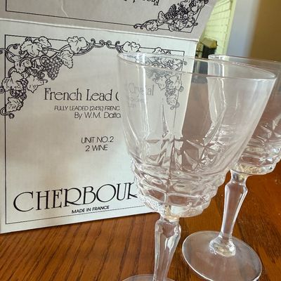 Sale Photo Thumbnail #36: Pair of W.M. Dalton French 24% lead crystal wine glasses in the Cherbourg pattern, displayed with their original box.