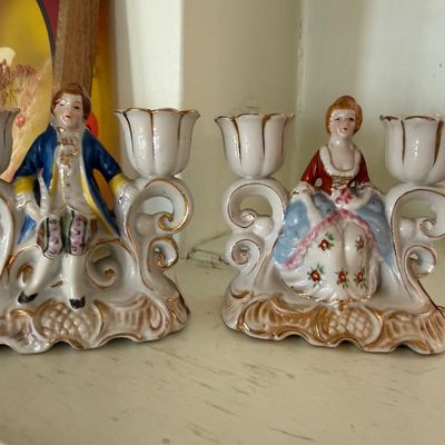 Sale Photo Thumbnail #37: Pair of vintage porcelain double-arm candelabras featuring 18th-century style courtly figures with gilt scrollwork accents.