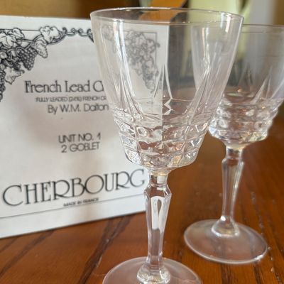 Sale Photo Thumbnail #35: Pair of vintage W.M. Dalton French lead crystal goblets in the Cherbourg pattern, displayed in front of their original box.