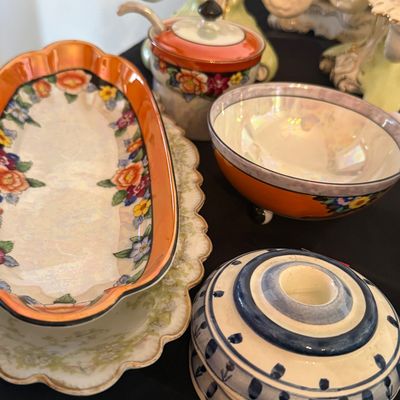 Sale Photo Thumbnail #28: Collection of vintage lusterware ceramic table service items, including an elongated dish, covered jam jar with spoon, small footed bowl, and a blue and white painted candlestick holder.