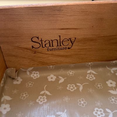 Sale Photo Thumbnail #7: Stanley Furniture brand maker's mark stamped inside a wooden drawer lined with floral paper.