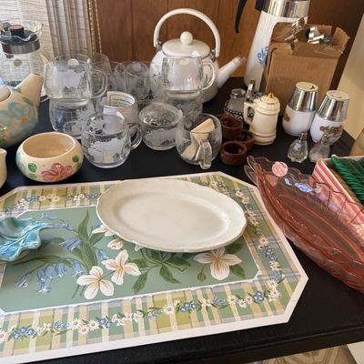 Sale Photo Thumbnail #22: Collection of vintage kitchenware and tableware, including frosted glass world map mugs, hand-painted ceramic teapots, pink glass relish dishes, and green spiral candles.