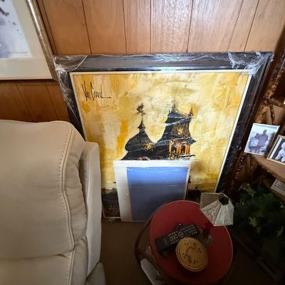 Mid-century modern oil painting by Van Gaard depicting architectural silhouettes on a yellow ground, plastic-wrapped in a dark wooden frame.