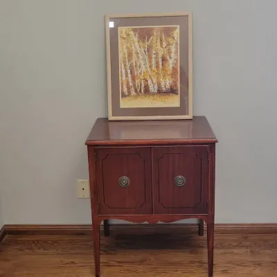Traditional Wood Accent Cabinet With Double Doors & Framed Autumn Landscape Artwork