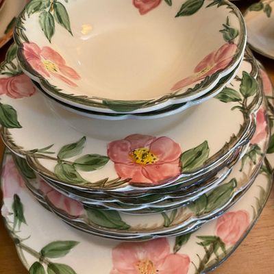 Sale Photo Thumbnail #34: Franciscan Desert Rose ceramic dinnerware stack featuring a small bowl, plates, and a serving platter with hand-painted wild rose motifs.