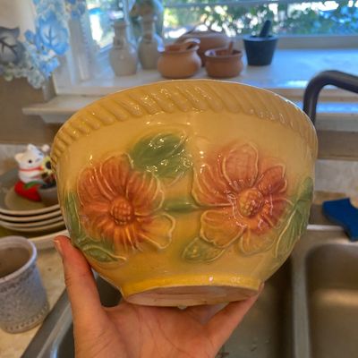 Sale Photo Thumbnail #17: Vintage McCoy ceramic pottery bowl featuring a yellow glaze, embossed floral motif, and rope-trimmed rim.