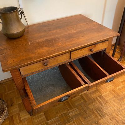 Sale Photo Thumbnail #6: Antique rustic pine baker's cabinet featuring two top drawers and two metal-lined tilt-out flour bins.