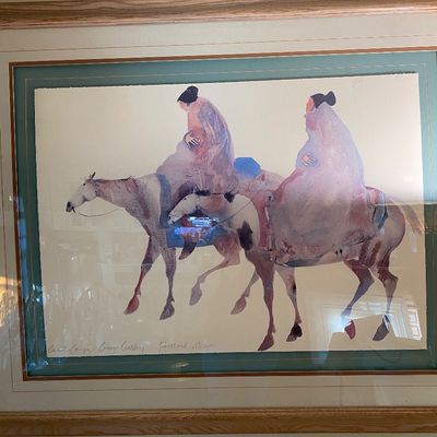 Sale Photo Thumbnail #85: Framed and matted Carol Grigg exhibition poster featuring a watercolor depicting Native American figures on horseback, presented in a light wood frame.