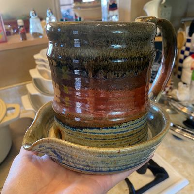 Sale Photo Thumbnail #44: Handmade studio pottery bacon cooker with attached catch tray, featuring multi-colored dripped and banded earth-tone glazes.