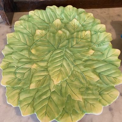 Sale Photo Thumbnail #18: Vintage ceramic majolica leaf platter featuring embossed green foliage and vines with a scalloped edge.