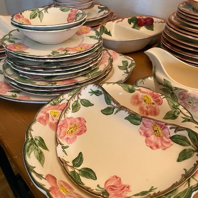 Sale Photo Thumbnail #33: Franciscan Desert Rose pattern ceramic dinnerware set, including serving platters, bowls, gravy boat, and stacked plates.