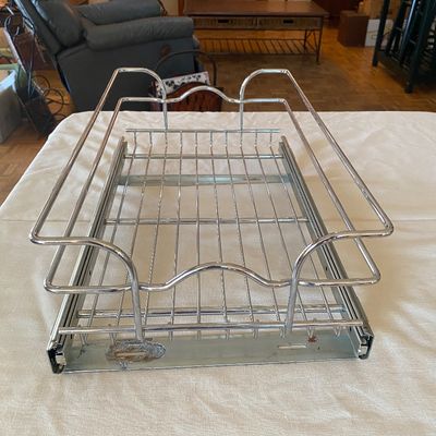 Sale Photo Thumbnail #81: Chrome pull-out cabinet wire basket organizer featuring built-in side slide rails, showing light surface wear and minor oxidation.