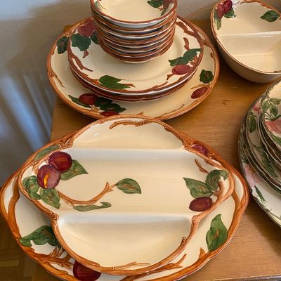 Sale Photo Thumbnail #32: Franciscan Orchard Glade ceramic dinnerware service including divided serving dishes, stacked bowls, and dinner plates with hand-painted fruit motif.