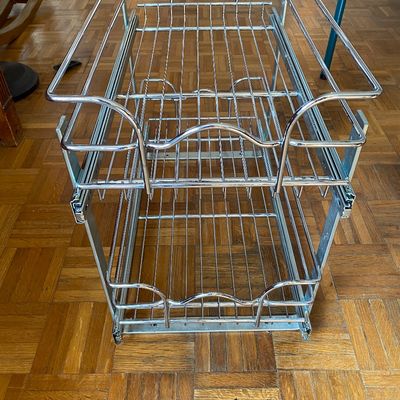 Sale Photo Thumbnail #79: Two-tier chrome pull-out wire basket system designed for under-cabinet or pantry storage.