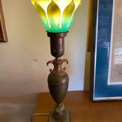 Sale Photo Thumbnail #68: Vintage table lamp featuring an urn-form patinated metal base on a square alabaster foot, topped with a tulip-shaped yellow and green art glass shade.