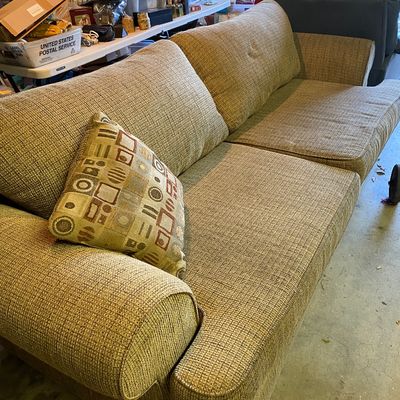 Sale Photo Thumbnail #58: Contemporary textured tweed light green sofa with rolled arms, loose seat cushions, and a geometric pattern throw pillow.