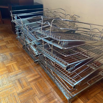 Sale Photo Thumbnail #76: Stack of pull-out chrome wire baskets and cabinet organizer shelving with mounting hardware.