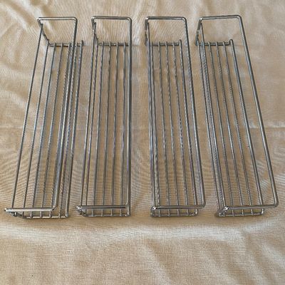 Sale Photo Thumbnail #80: Set of four chrome metal wire spice or storage racks, designed for wall or cabinet mounting.