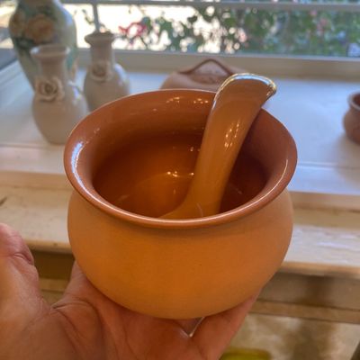 Sale Photo Thumbnail #43: Terracotta glazed sugar bowl or condiment pot with matching spoon, featuring a glossy interior finish.