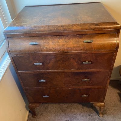 Sale Photo Thumbnail #64: Vintage burl wood four-drawer chest featuring cabriole legs and decorative pull handles, showing light surface wear.
