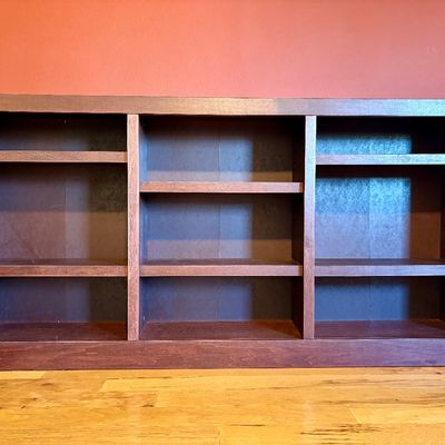 Cherry stained horizontal bookcase with adjustable shelves. Measurements: W - 72" / D - 10.75" / H - 36"