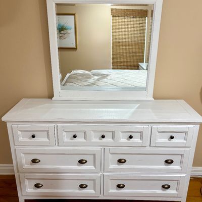 Magnussen Home Heron Cove 7-drawer dresser with mirror. Measurements: W - 64" / D - 19" / H - 38". The mirror is an...