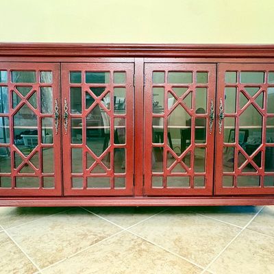 Distressed red Chippendale style accent cabinet. Measurements: W - 72" / D - 17.5" / H - 39.25"