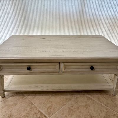 Haverty's Beckley Farmhouse distressed white coffee table with 2 drawer storage. Measurements: L - 50" / D - 30" / H -...
