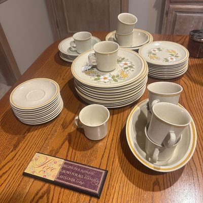 Sale Photo Thumbnail #35: Vintage 1970s stoneware dinnerware service, featuring floral motif dinner plates, side plates, saucers, bowls, and matching coffee mugs.