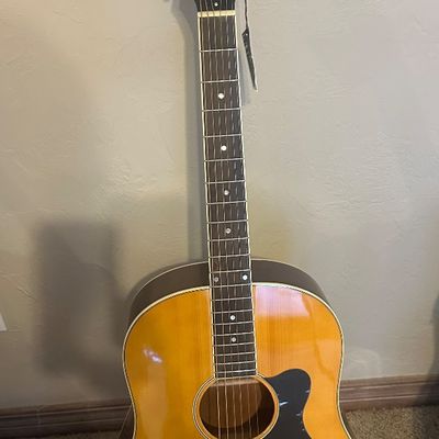 Sale Photo Thumbnail #31: Recording King acoustic dreadnought guitar with a natural finish top, dark pickguard, and white headstock lettering.