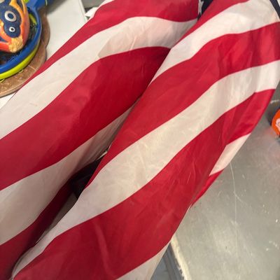 Sale Photo Thumbnail #22: Pair of folding lawn chairs packed into American flag-patterned carrying sleeves.