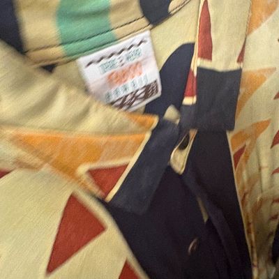 Sale Photo Thumbnail #35: Vintage Taboo brand short-sleeve shirt featuring a bold geometric abstract print in yellow, orange, and black.