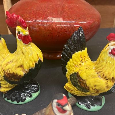 Sale Photo Thumbnail #14: Pair of vintage hand-painted ceramic rooster figurines featuring yellow, green, and red glaze with visible crazing.