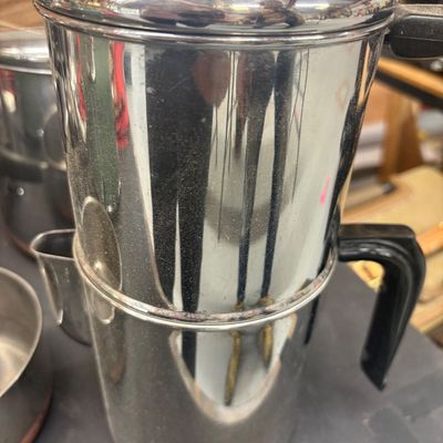 Sale Photo Thumbnail #16: Vintage stainless steel percolator coffee pot with a black bakelite handle and domed lid.