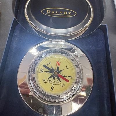 Sale Photo Thumbnail #13: Dalvey pocket compass in a polished stainless steel clamshell case, displayed inside its original blue velvet-lined box.