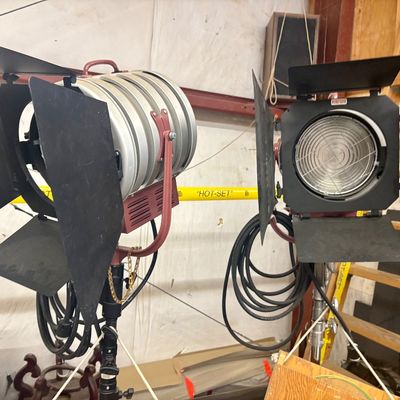 Sale Photo Thumbnail #51: Pair of professional stage studio lights with adjustable barn doors mounted on heavy-duty metal stands.