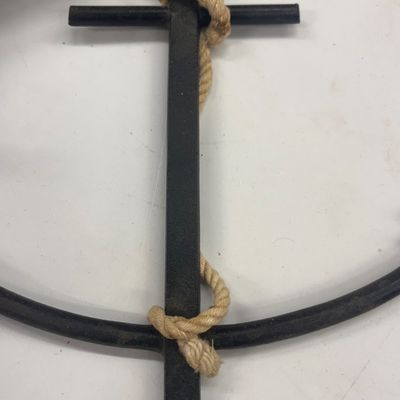 Sale Photo Thumbnail #50: Black wrought iron decorative anchor wall hanging with natural rope detail.